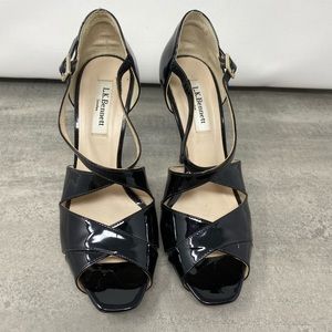 L.K. Bennett black patent leather shoes. Heels are 4 inches high. Size 38.5.